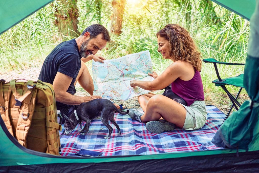 A couple enjoying summer with their dog
