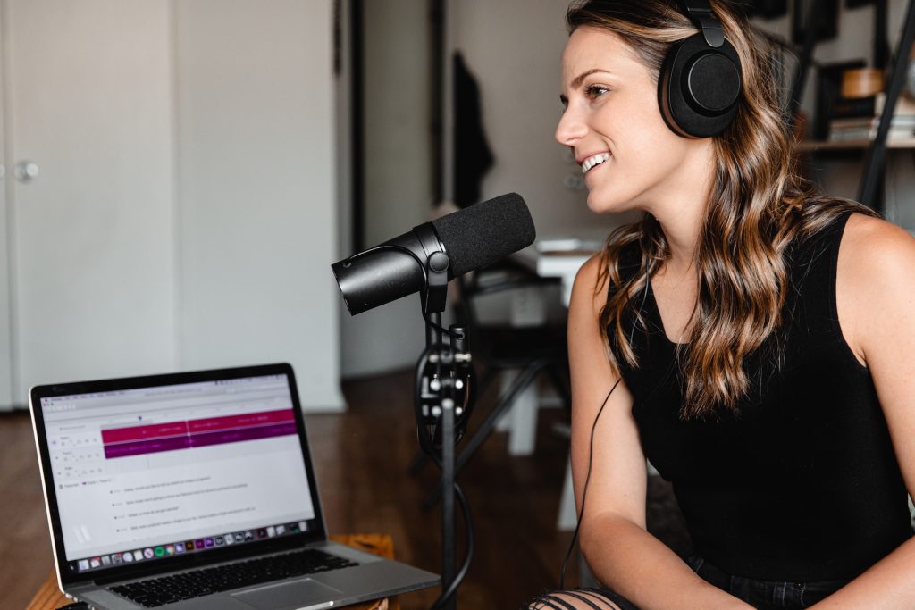 A woman doing a podcast