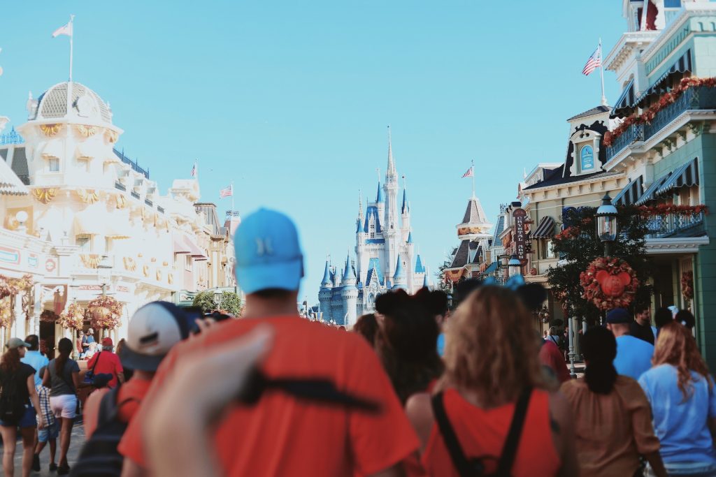 A crowd of vacationers heading to Disney for vacation