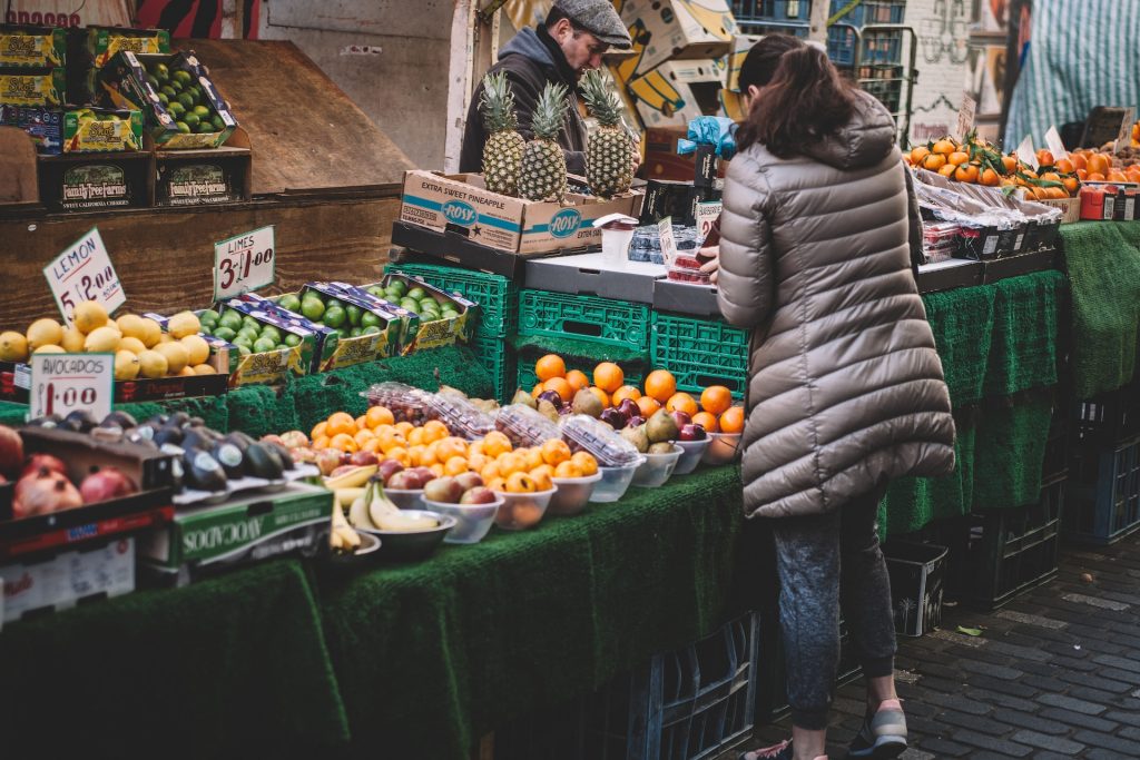 A woman buying groceries from a store with a loyalty program