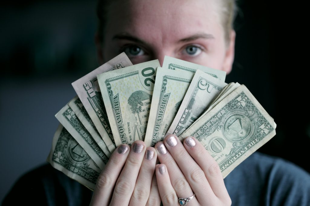 A lady holding money