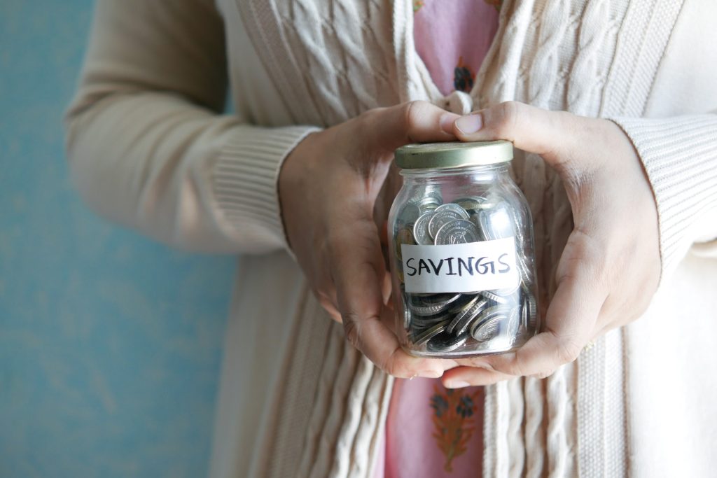 A person holding savings