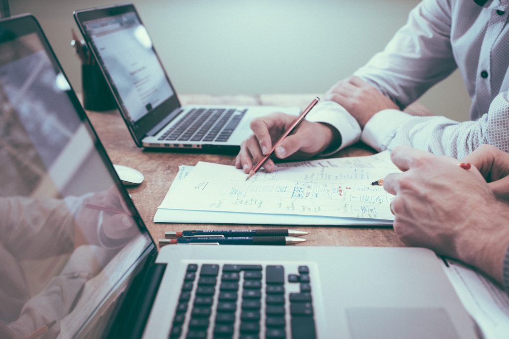 Two people doing data entry work