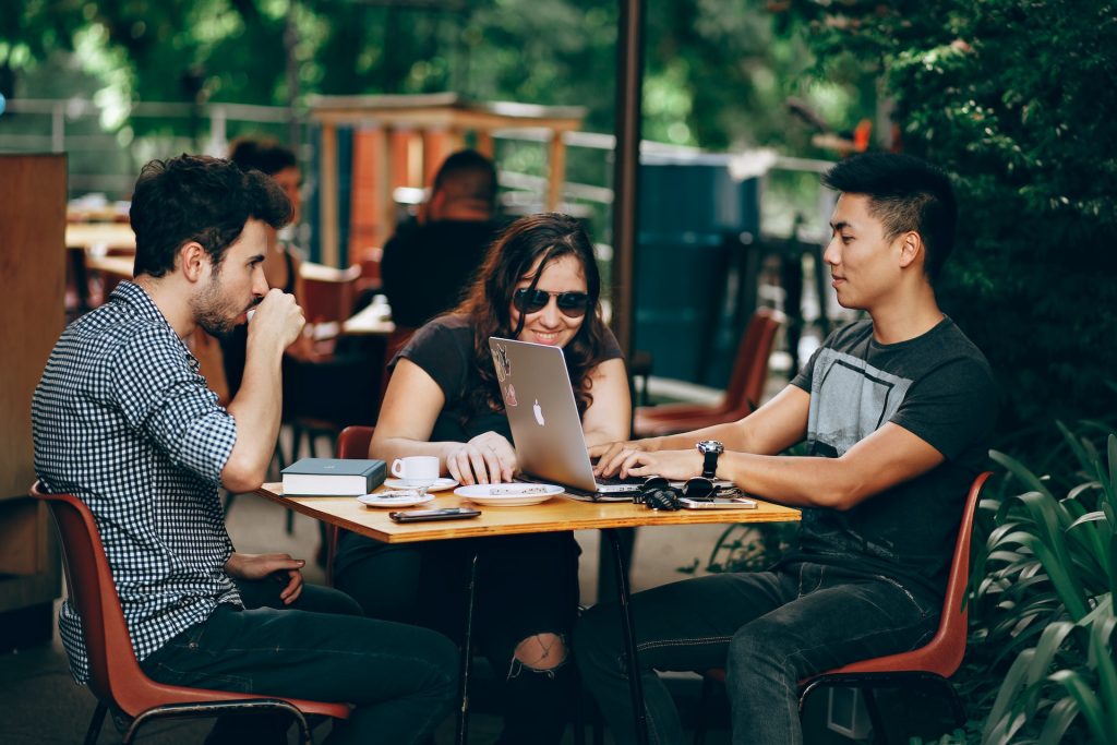 Remote workers catching up outdoors