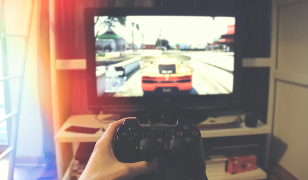 A gamer playing a car racing game