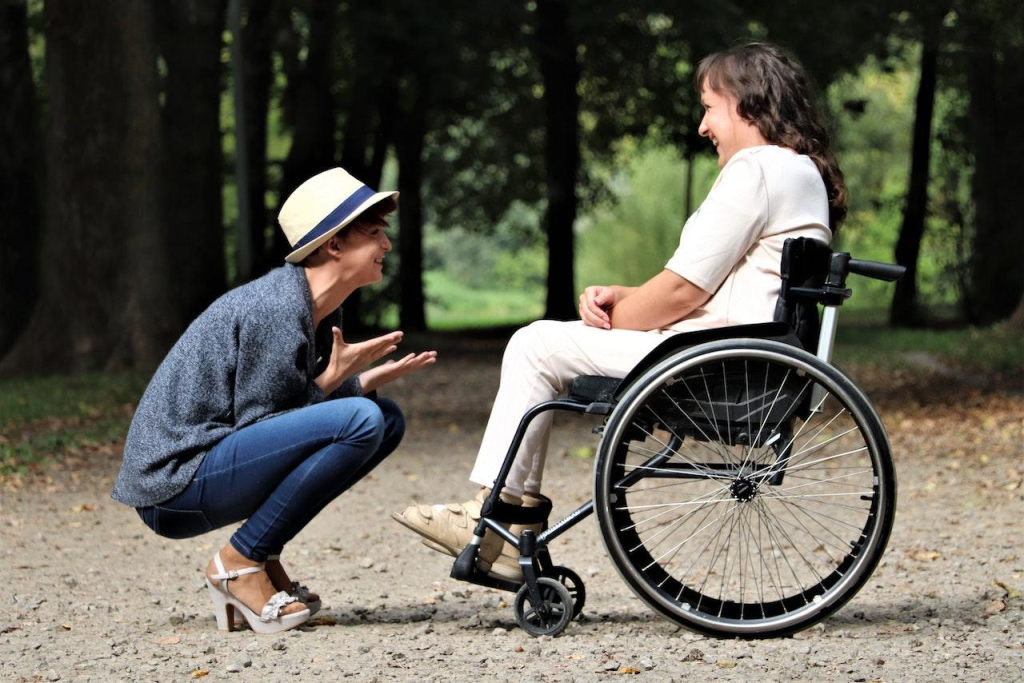 A family caregiver taking care of a disabled family member