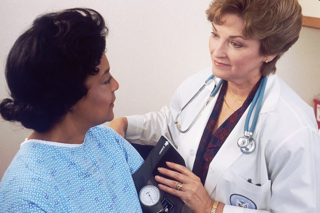 A doctor attending to a patient