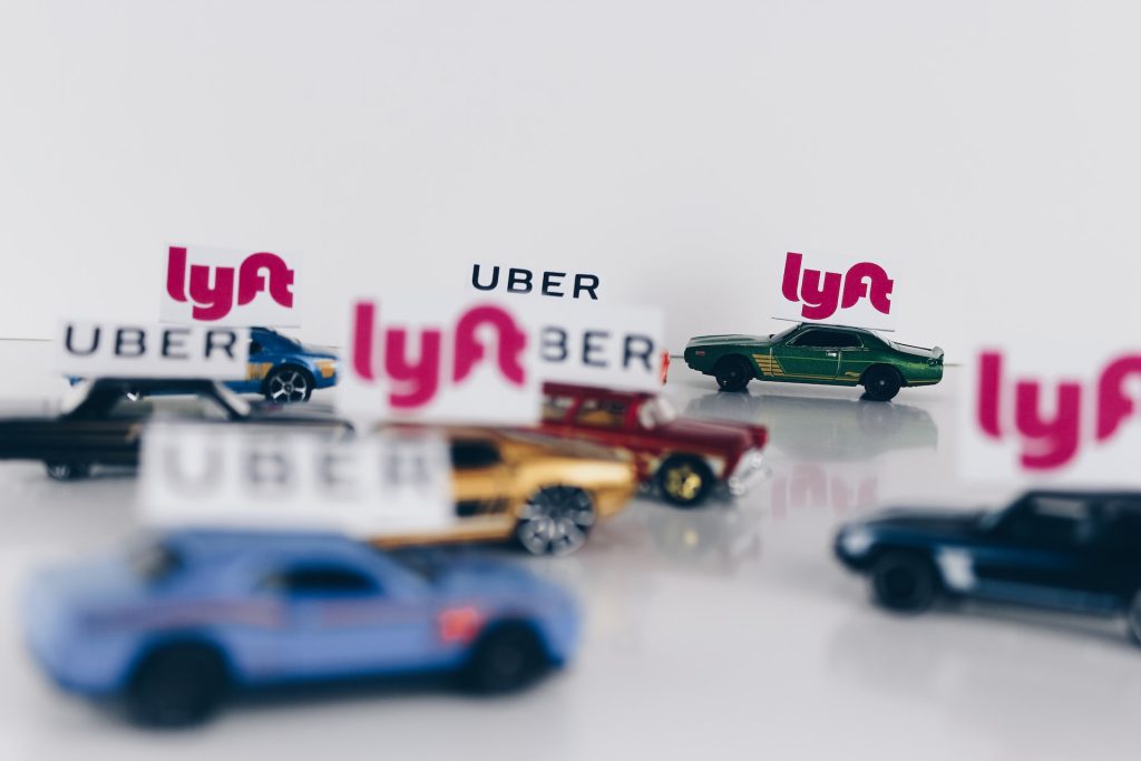 A banner showing driving apps, lyft and uber