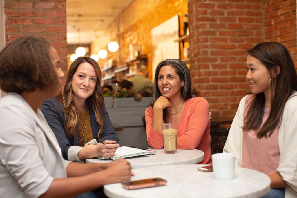 A group of women following up a conversation