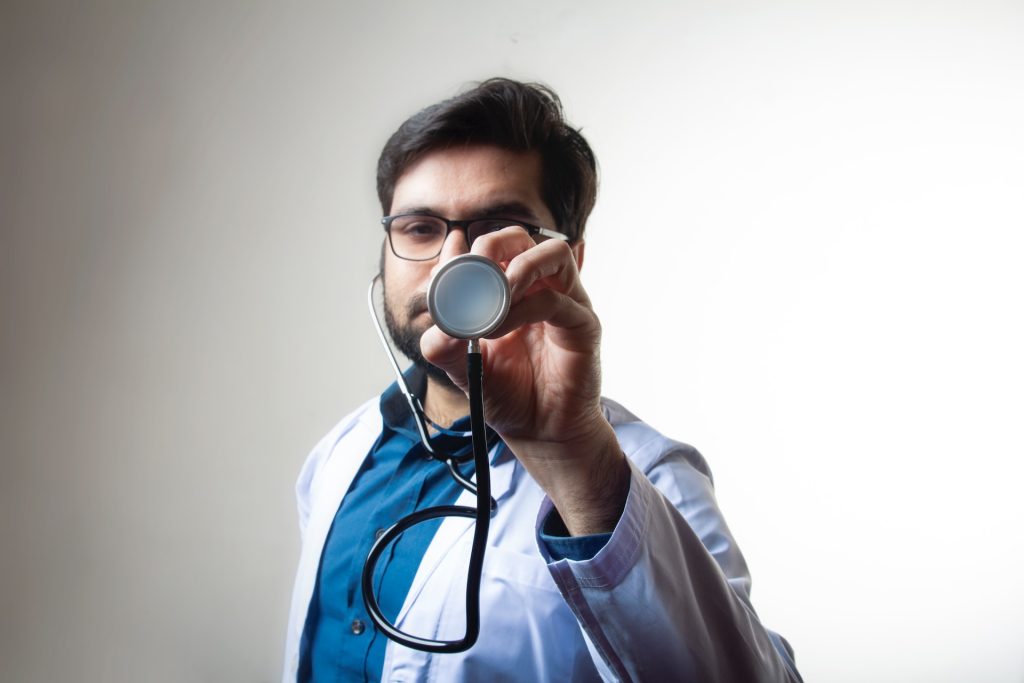 A medical student holding a stethoscope