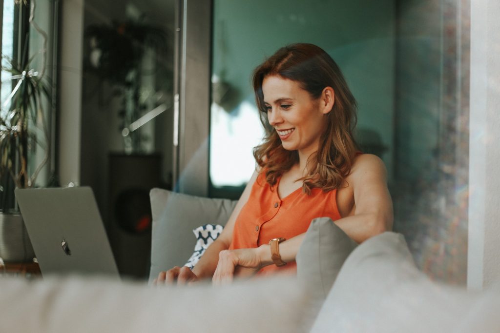 A woman working remotely on her laptop