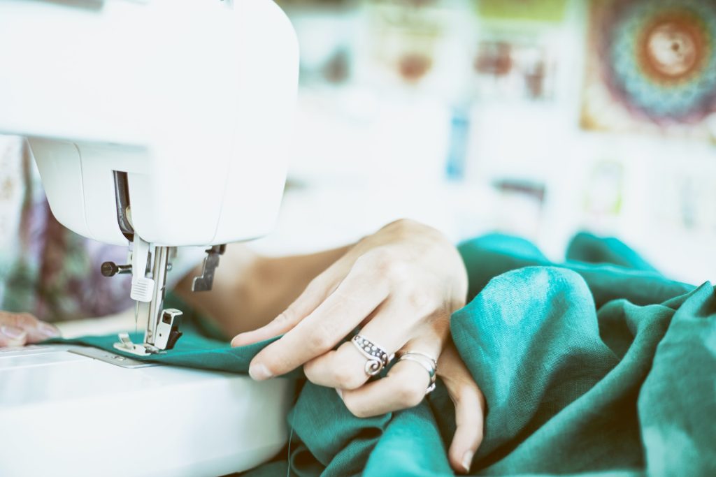 A lady using a sewing machine