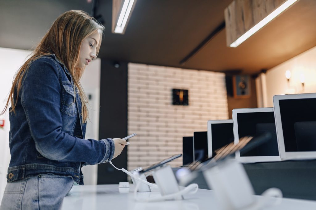 A woman in a second hand electronics shop